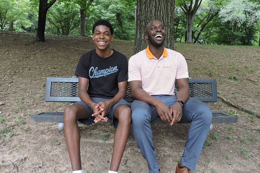 mentee and mentor sitting on bench